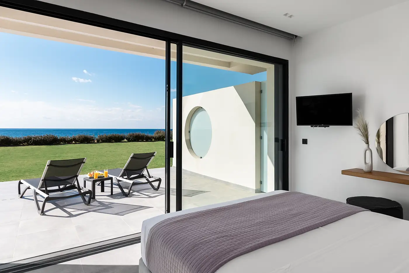 Ground-floor room overlooking the sea and front garden.